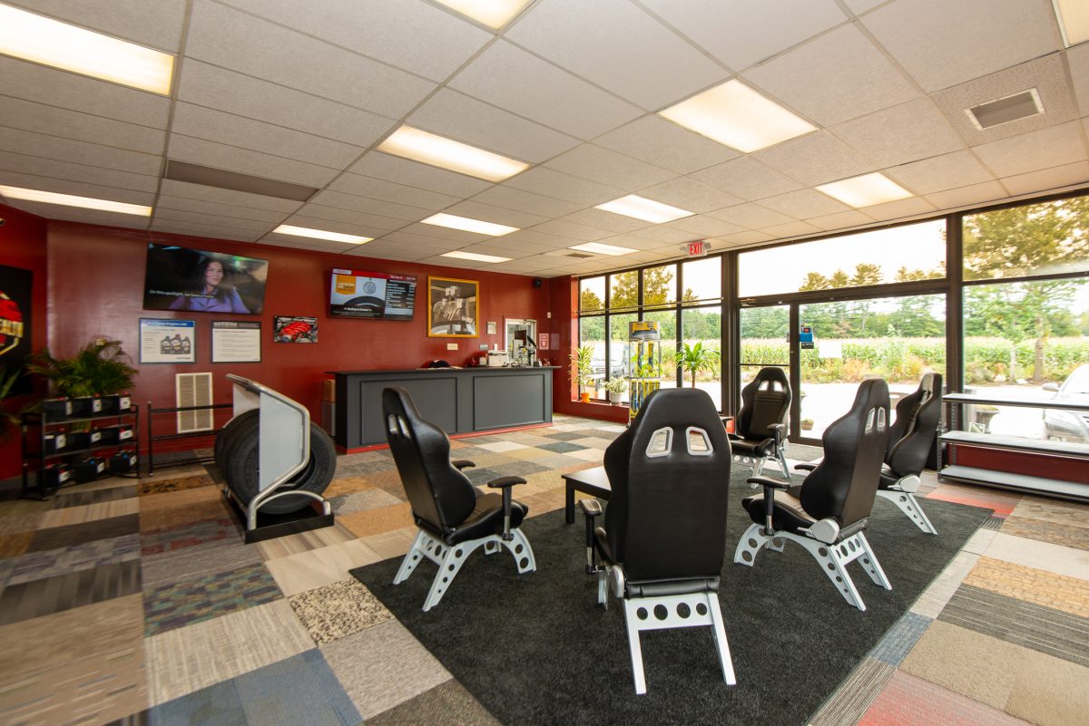 A room with several chairs and tables in it