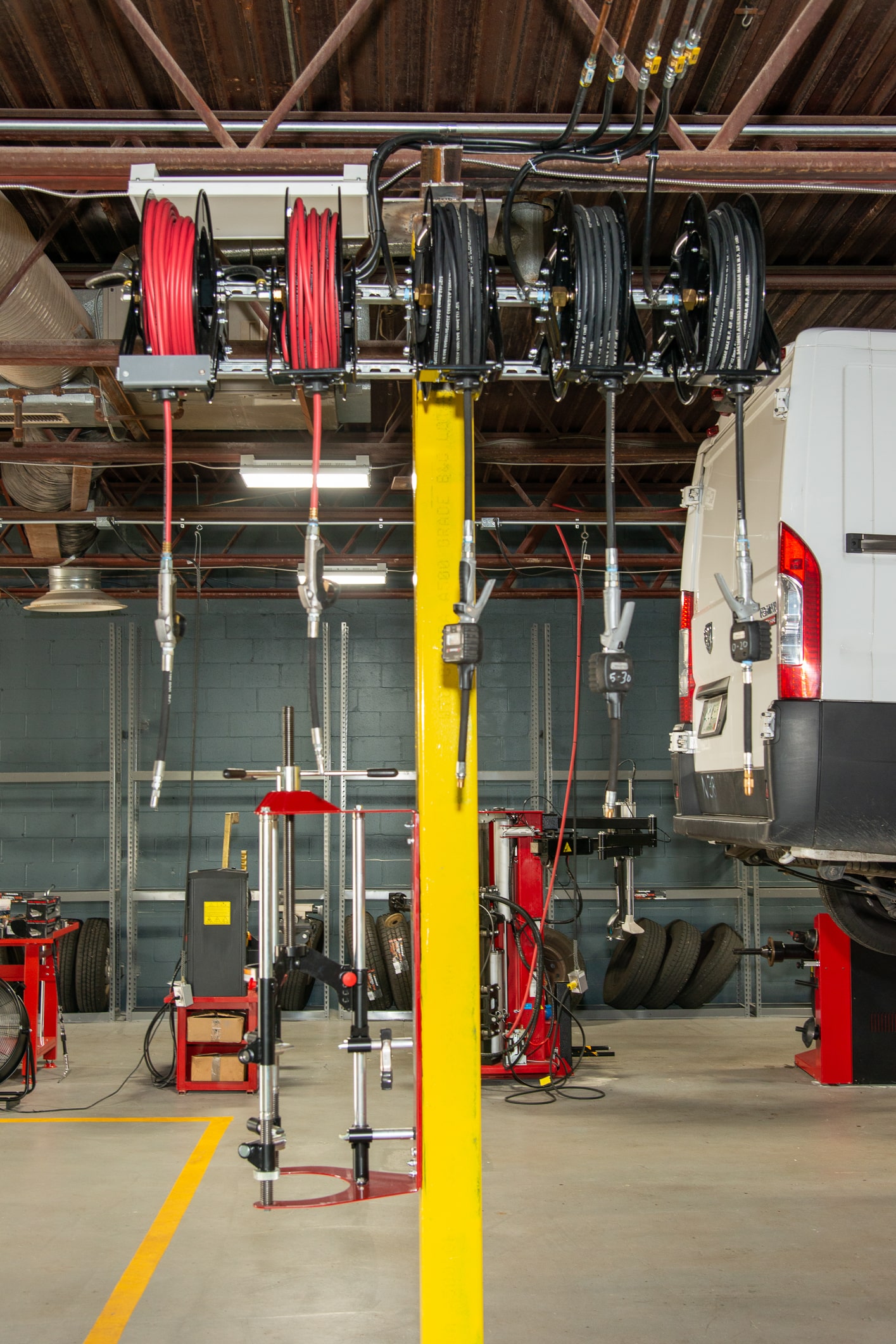 A bus is being worked on in the garage.